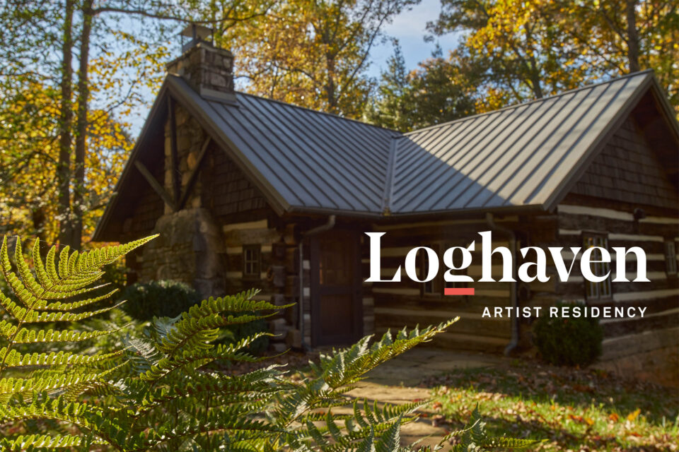 Image of a Loghaven cabin and ferns with the white and red Loghaven logo 
